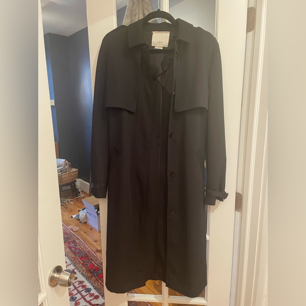 Aritzia women’s black trench coat.